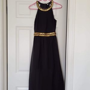 Long black dress with gold accents